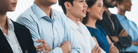 Diverse group of professional business people stand in line with cross arm gesture in modern...