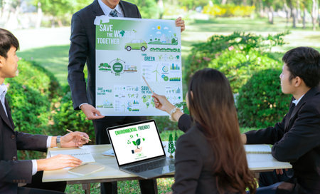 Group of asian business people presenting environmentally friendly development plan and sustainable technology project for greener future, establishing outdoor eco business office at natural park.Gyreの写真素材