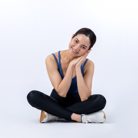 Full body asian woman in sportswear portrait, smiling and posing cheerful gesture. Workout training with attractive girl engage in her pursuit of healthy lifestyle. Isolated background Vigorousの写真素材