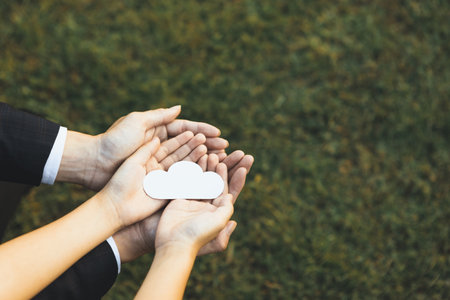 Top view hand holding CO2 gases icon symbolize eco-friendly business corporation committed to environmental friendly transport and zero carbon emission. Corporate responsible for greener society. Gyreの写真素材