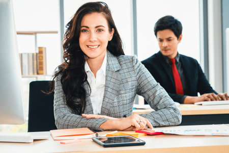 Business people working at table in modern office room while analyzing financial data report . Jivyの写真素材