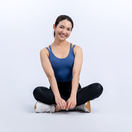 Full body asian woman in sportswear portrait, smiling and posing cheerful gesture. Workout training with attractive girl engage in her pursuit of healthy lifestyle. Isolated background Vigorousの写真素材