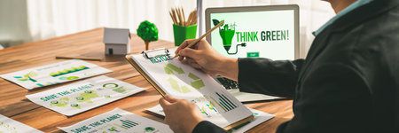 Businessman in green corporate company planning eco-friendly and environmental conservative to...