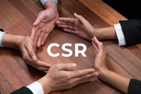 Top view group of business people forming circle hand together around eco-friendly CSR icon on meeting table as concept of corporate responsible for sutainable society and greener community. Quaintの写真素材