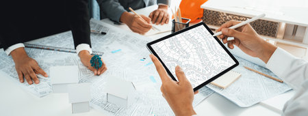 Worker, architect and engineer work on real estate construction project oratory planning with...