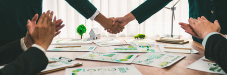 Business people hand shake in Eco corporate meeting room after made successful agreement deal on eco-friendly products. Sustainability and environmental protection in business cooperation.Trailblazingの写真素材