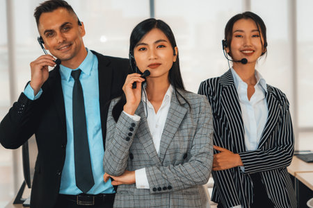 Business people wearing headset working in office to support remote customer or colleague. Call center, telemarketing, customer support agent provide service on telephone video conference call. Jivyの写真素材