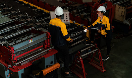 Factory quality control inspector conduct safety inspection on steel machinery and manufacturing...