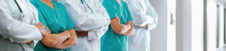 Confident medical staff team with doctor nurse and healthcare specialist professions people in hospital or clinic corridor. Medical and healthcare community in panoramic banner. Neotericの写真素材