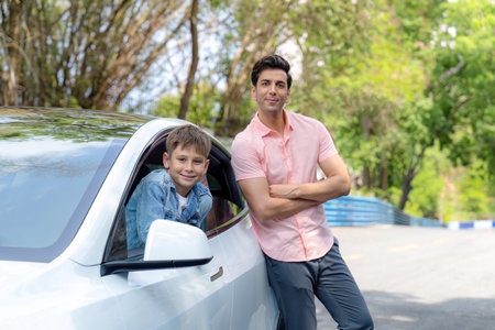 Dad and son on the road trip by the green nature countryside, family vholiday vacation concept....