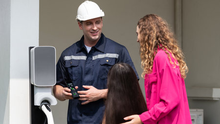 Technician install home EV charging station, providing service support for EV app on customer...