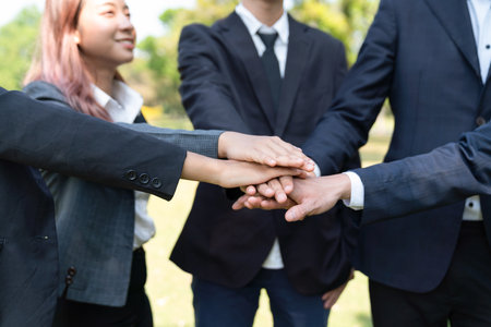 Eco business people join hand together as teamwork and unity, outdoor business volunteer mission for...
