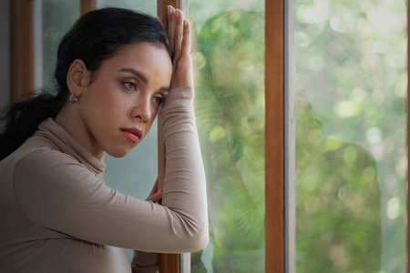 Depressed young Black woman with mental health problem in mind need crucial treatment from overthinking fatigue girl, disruptive thought, dissocial, anxiety and other mental health disorders .の写真素材