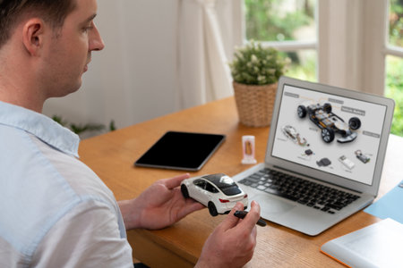 Car design engineer analyze car prototype for automobile business at home office. Automotive...