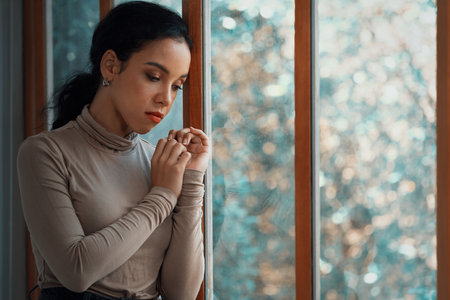 Depressed young Black woman with mental health problem in mind need crucial treatment from overthinking fatigue girl, disruptive thought, dissocial, anxiety and other mental health disorders .の写真素材