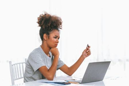 Stressed young woman has financial problems with credit card debt to pay crucial show concept of bad personal money and mortgage pay management crisis.の写真素材