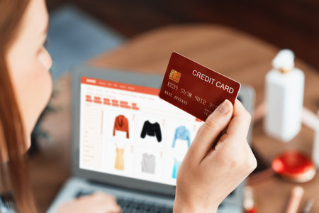 Woman shopping online on internet marketplace browsing for sale items for modern lifestyle and use credit card for online payment from wallet protected by utmost cyber security softwareの写真素材
