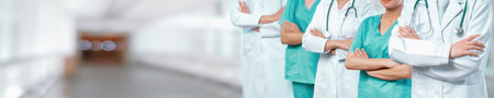 Confident medical staff team with doctor nurse and healthcare specialist professions people in blurry hospital corridor background. Medical and healthcare community in panoramic banner. Neotericの写真素材