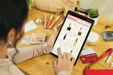 Woman shopping online on internet marketplace browsing for sale items for modern lifestyle and use credit card for online payment from wallet protected by crucial cyber security softwareの写真素材