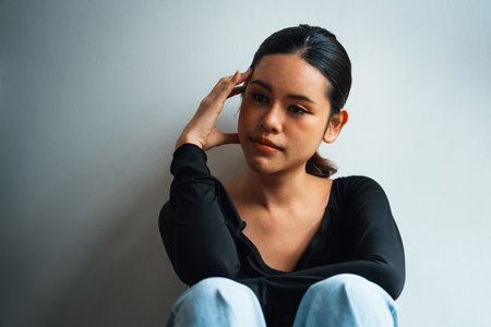 Depressed young Asian woman with mental health problem in mind need uttermost treatment from...