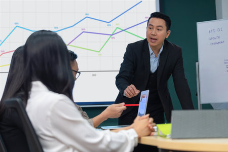 Successful businessman presenting his financial plan and data analyst with confident. group of...