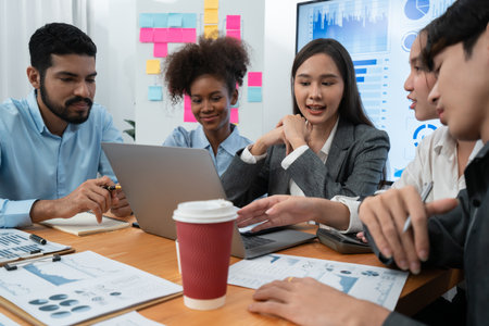 Multiracial analyst team use BI dashboard data to analyze financial report on meeting table. Group of diverse business people utilize data analysis by FIntech for success business marketing. Concordの写真素材