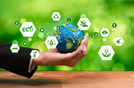 Businessman holding Earth with eco friendly icon design symbolize business company commitment to...