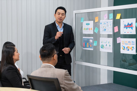 Successful businessman presenting his financial plan and data analyst with confident. group of...