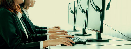 Business people wearing headset working in office to support remote customer or colleague. Call...