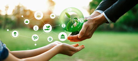 Businessman and little kid holding seedling plant together with ESG and eco icon. Green business investing on environment sustainability to provide greener future for next generation. Panoramaの写真素材
