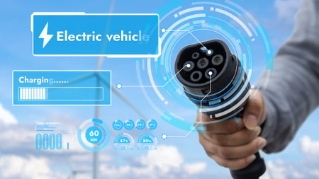 Focus EV charger pointing in front of camera display battery status hologram with blurry...