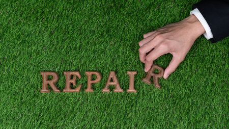 Eco awareness campaign showcase businessman hand arranged message in Repair on biophilic grass background. Environmental regeneration and repair Earth concept for sustainable and greener future. Gyreの写真素材