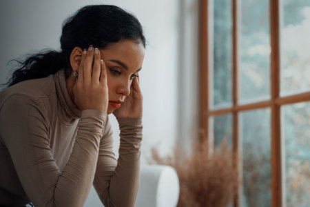 Depressed young Black woman with mental health problem in mind need crucial treatment from overthinking fatigue girl, disruptive thought, dissocial, anxiety and other mental health disorders .の写真素材