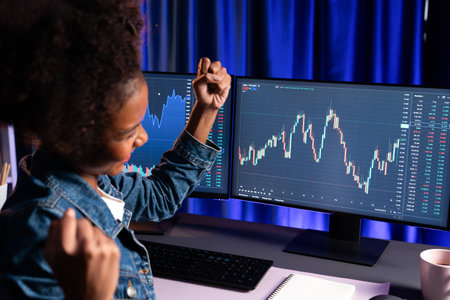 African woman blogger exited with happy face, pointing on screen with valued stock market...
