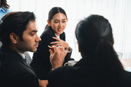 Diverse of business people from various ethnic group working in modern office environment. Productive and multi ethnic office workers engage in discussion for strategic business marketing. Meticulousの写真素材