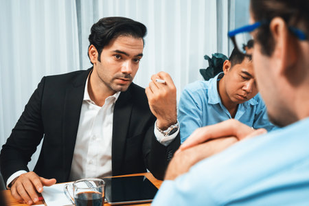 Diverse group of business analyst team analyzing financial data report paper on office table. Chart and graph dashboard by business intelligence analysis for strategic marketing planning Habilimentの写真素材