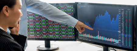 Expert successful businessman present stock market investment to smart beautiful investor during...