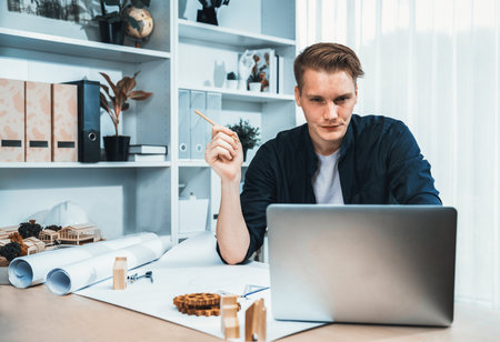 Portrait of architect designer sit at desk in office, brainstorm idea for architectural design...