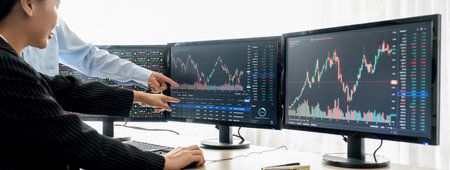 A cropped close-up image of professional smart trader hand pointing at financial growth graph while...