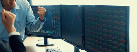 Collaborated business people cheering the increasing stock market graph.Show successful investment,...