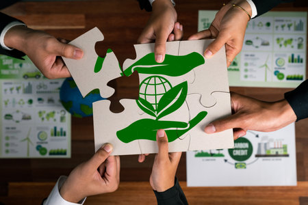 Top view cohesive group of business people forming jigsaw puzzle pieces in environmental awareness symbol as eco corporate responsibility as sustainable solution for greener Earth. Quaintの写真素材