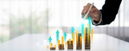 Coin stack with digital graphic indicator symbolizing business investment and economic growth....