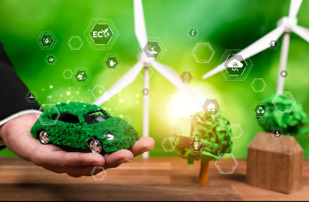 Businessman holding EV car showcase ESG commitment to clean energy for sustainable future and net zero world as automobile industry adopt environmentally greener and cleaner transportation. Relianceの写真素材