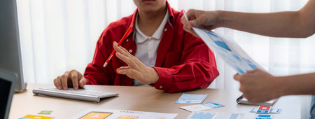 Panorama banner of startup company employee planning on user interface prototype for mobile...
