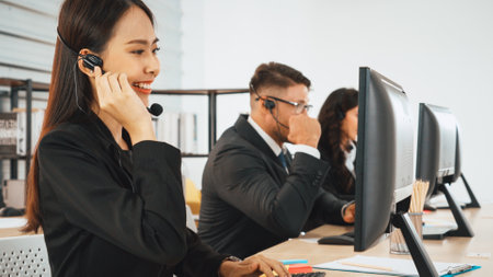 Business people wearing headset working in office to support remote customer or colleague. Call...