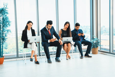 Job seekers and applicants waiting for interview on chairs in office. Job application and recruitment interview qualification concept. Jivyの写真素材