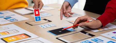 Panorama banner of startup company employee planning on user interface prototype for mobile...