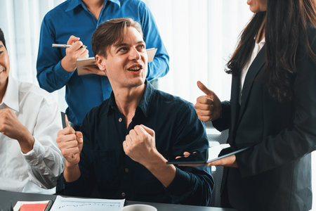 Excited and happy office worker employee celebrate after make successful strategic business marketing planning. Teamwork and positive attitude create productive and supportive workplace. Prudentの写真素材