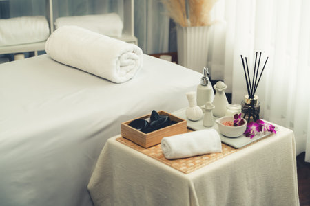 Exquisite display of beauty treatment and spa salon accessories arranged on spa table in luxury spa resort. Relaxing spa massage and recreation background concept. Quiescentの写真素材