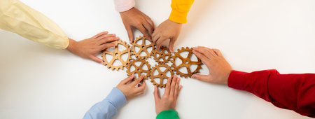 Startup company employee joining cogwheel gear together symbolize function productive system and...